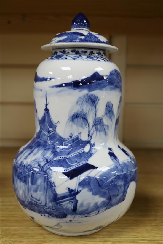 A Chinese blue and white gourd-shaped vase and cover, late 19th century, height 28cm
